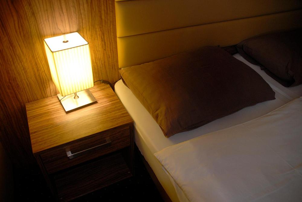 Postel nebo postele na pokoji v ubytování Hotel Opara