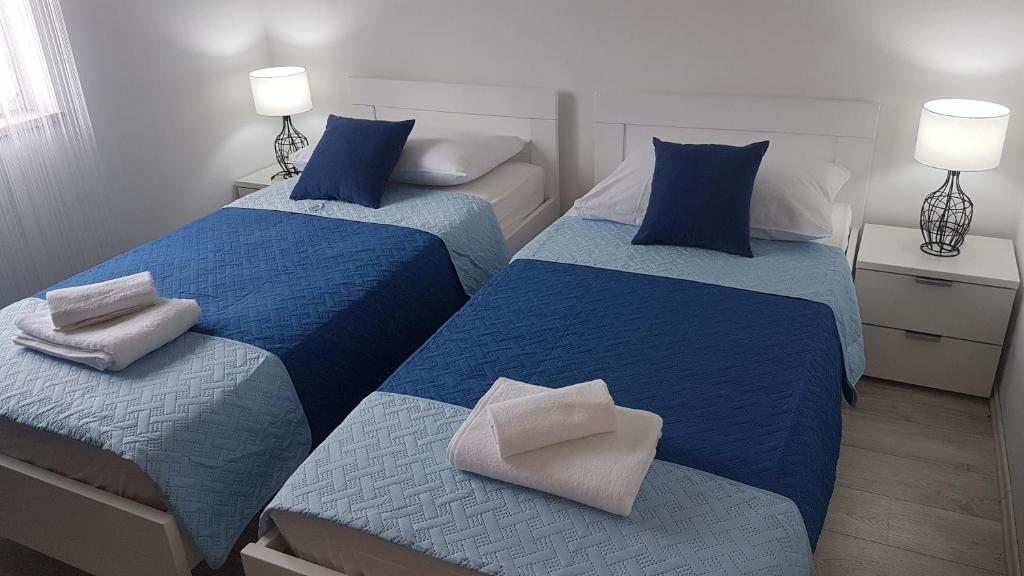 Postel nebo postele na pokoji v ubytování Apartment Azaleja