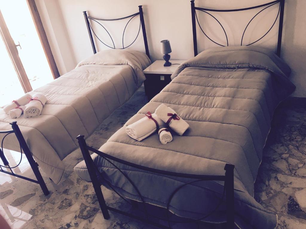 Postel nebo postele na pokoji v ubytování B&B Lo Scrigno