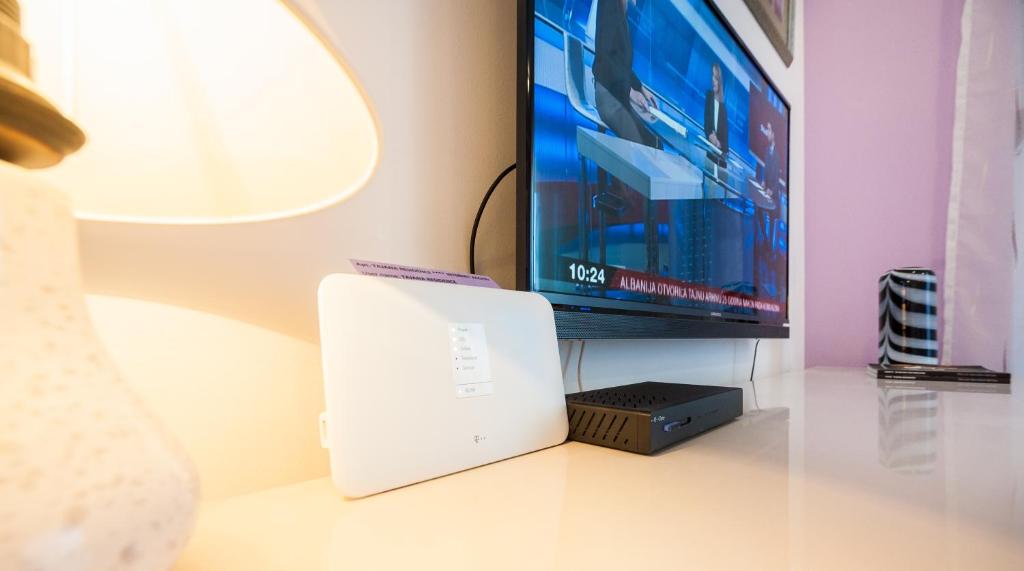 Televízia a/alebo spoločenská miestnosť v ubytovaní Apartment Tajana Residence
