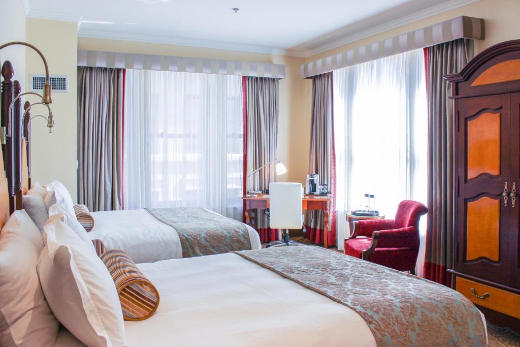 Postel nebo postele na pokoji v ubytování Hotel Providence