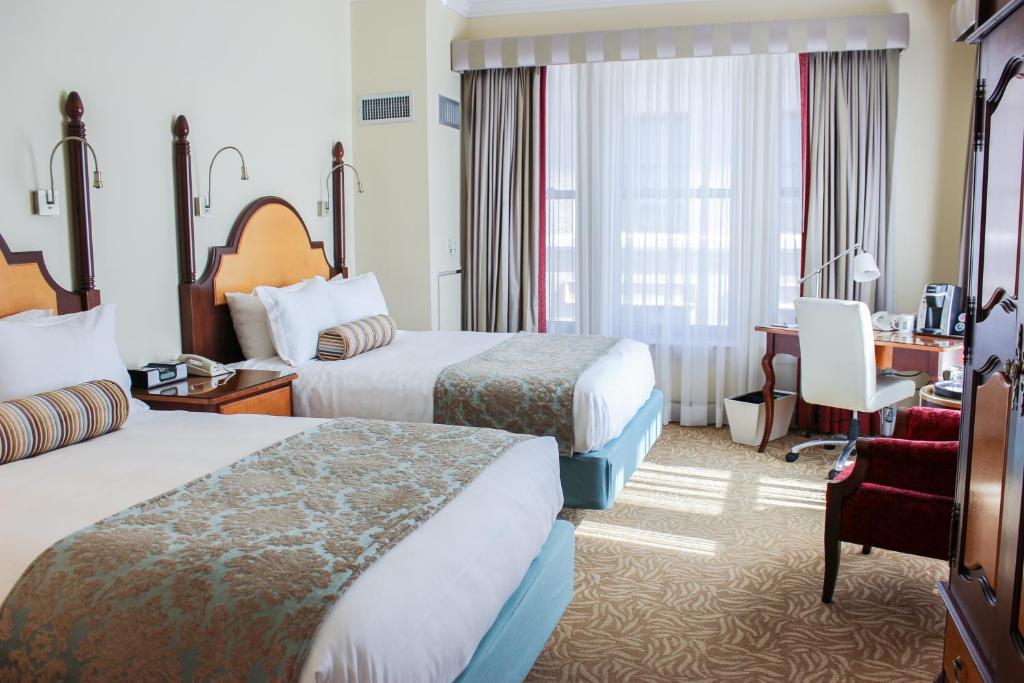 Postel nebo postele na pokoji v ubytování Hotel Providence