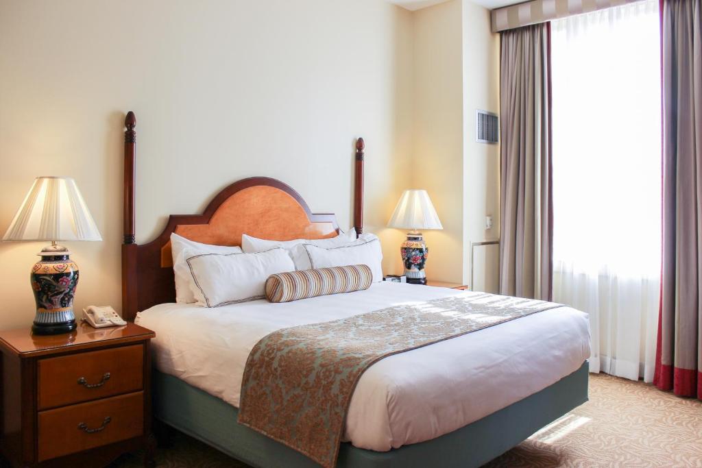 Postel nebo postele na pokoji v ubytování Hotel Providence