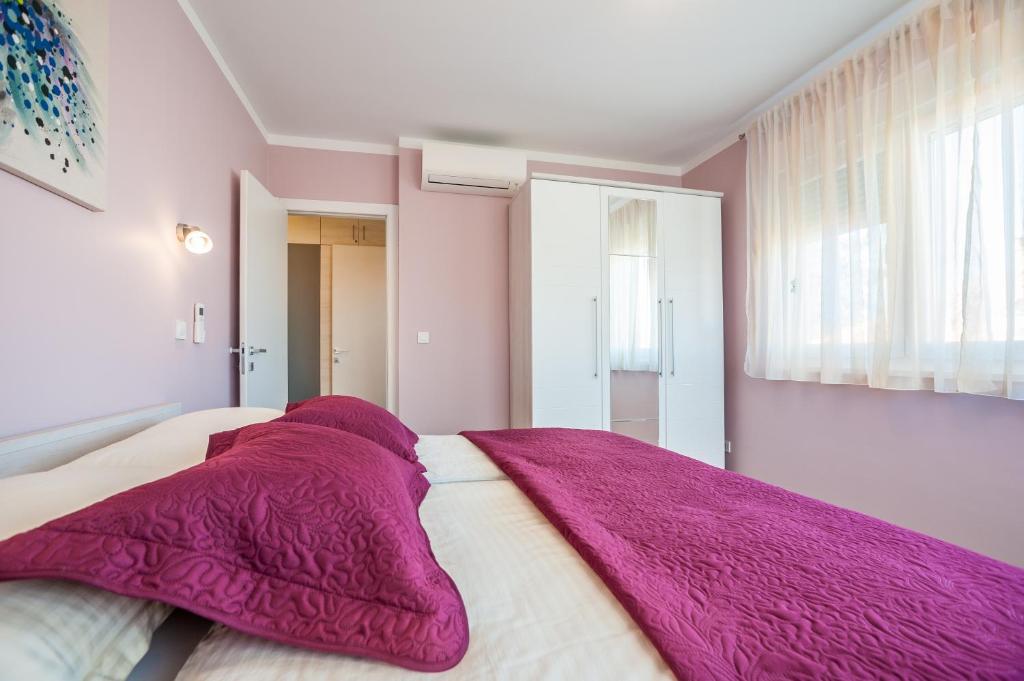 Posteľ alebo postele v izbe v ubytovaní Apartment Tajana Residence