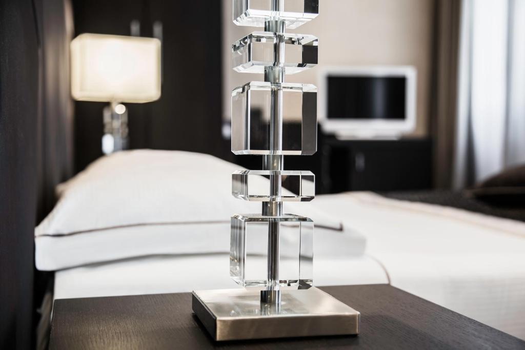 Postel nebo postele na pokoji v ubytování Hotel Principe Di Torino