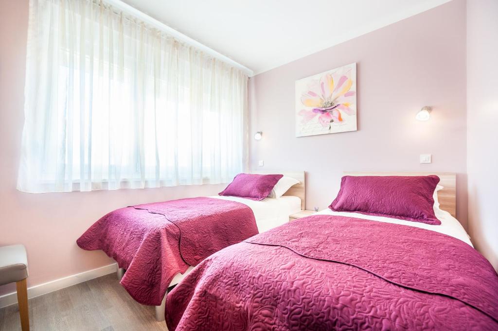 Posteľ alebo postele v izbe v ubytovaní Apartment Tajana Residence