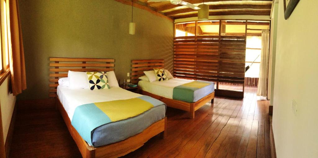 Postel nebo postele na pokoji v ubytování Heliconia Amazon River Lodge
