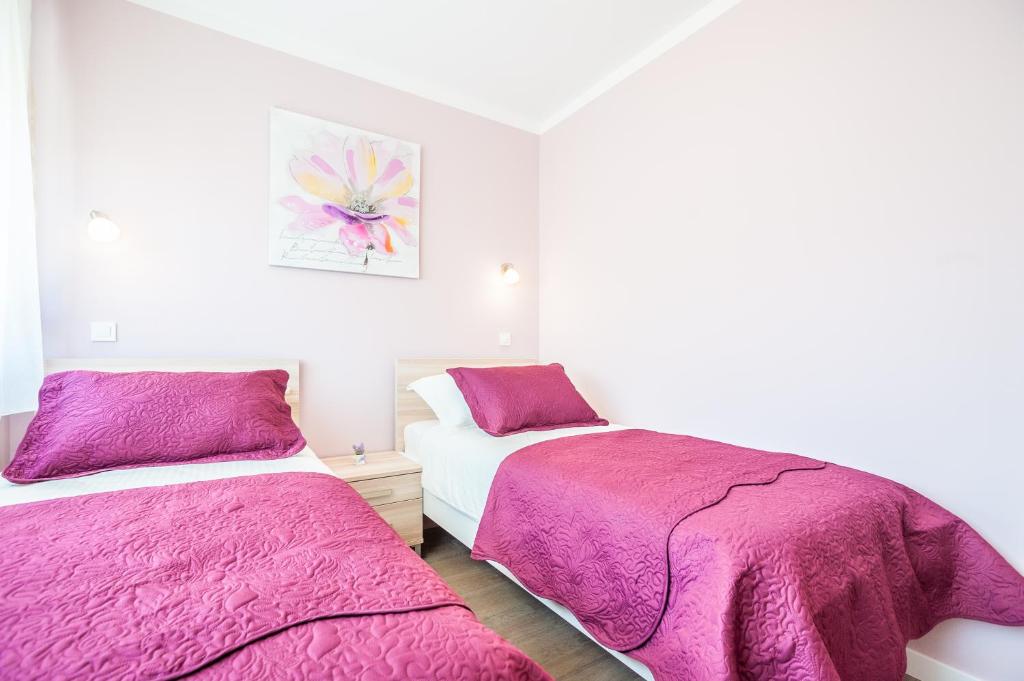 Posteľ alebo postele v izbe v ubytovaní Apartment Tajana Residence