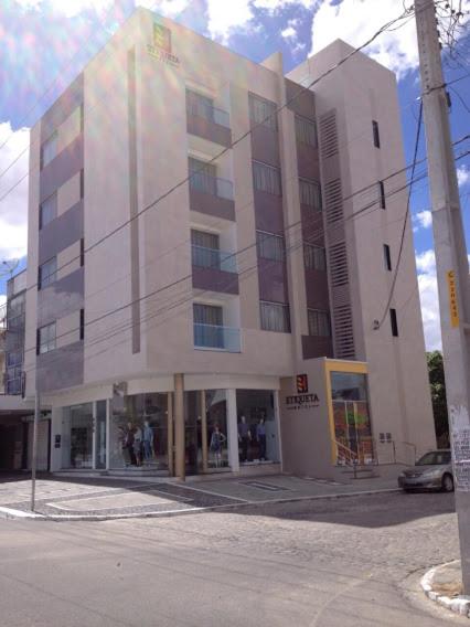 a building on the corner of a street at Etiqueta Hotel in Santa Cruz do Capibaribe
