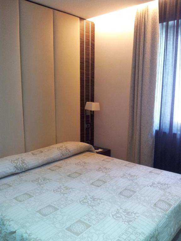 Postel nebo postele na pokoji v ubytování Hotel Excelsior