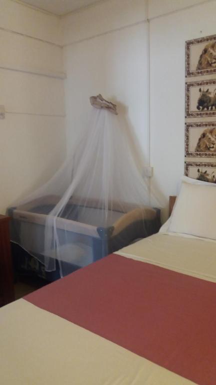 Voodi või voodid majutusasutuse Habitation Joseph toas