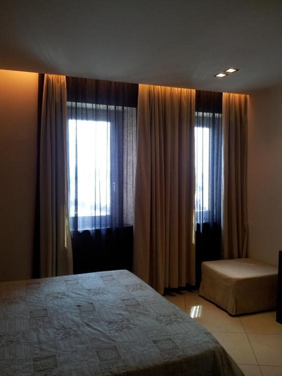 Postel nebo postele na pokoji v ubytování Hotel Excelsior
