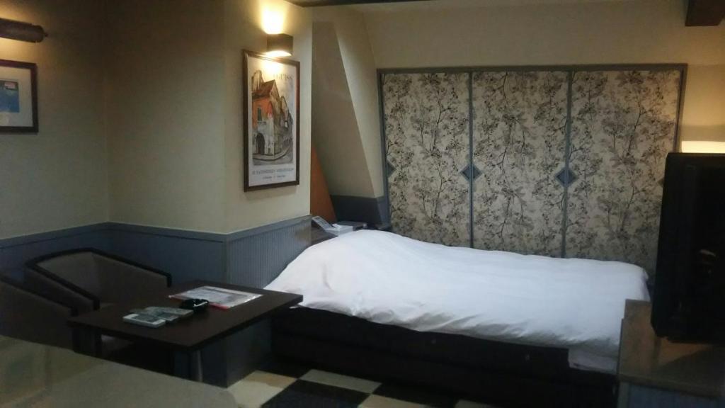 Postel nebo postele na pokoji v ubytování Hotel Sting