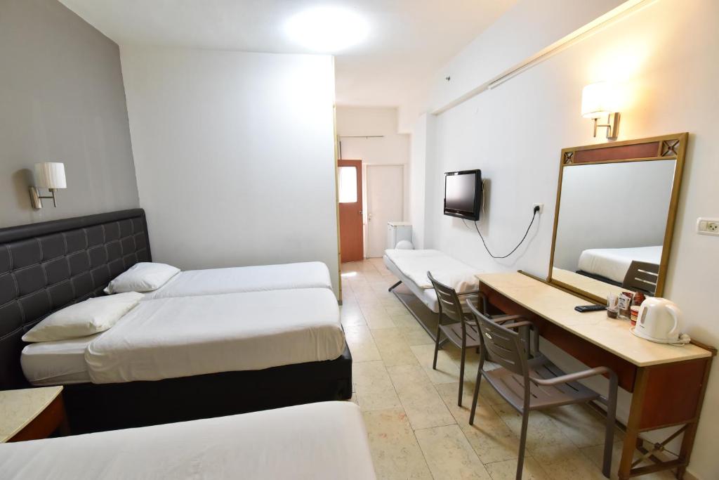 Postel nebo postele na pokoji v ubytování Hotel Maman