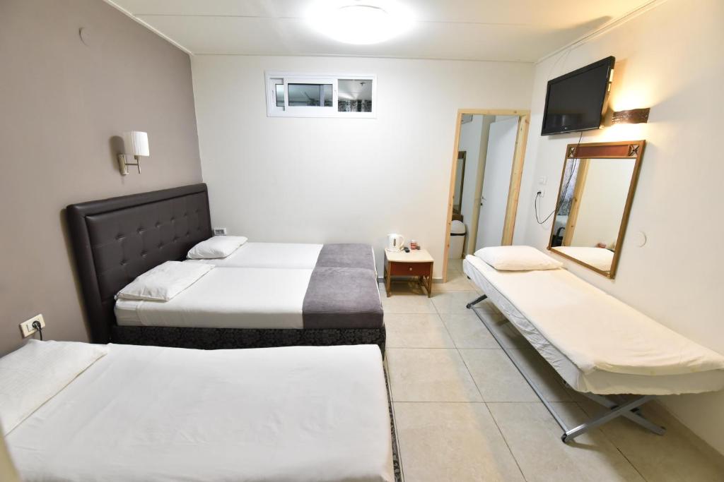 Postel nebo postele na pokoji v ubytování Hotel Maman