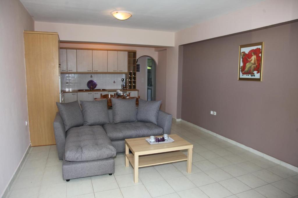 a living room with a couch and a coffee table at Villa Elena in Lixouri
