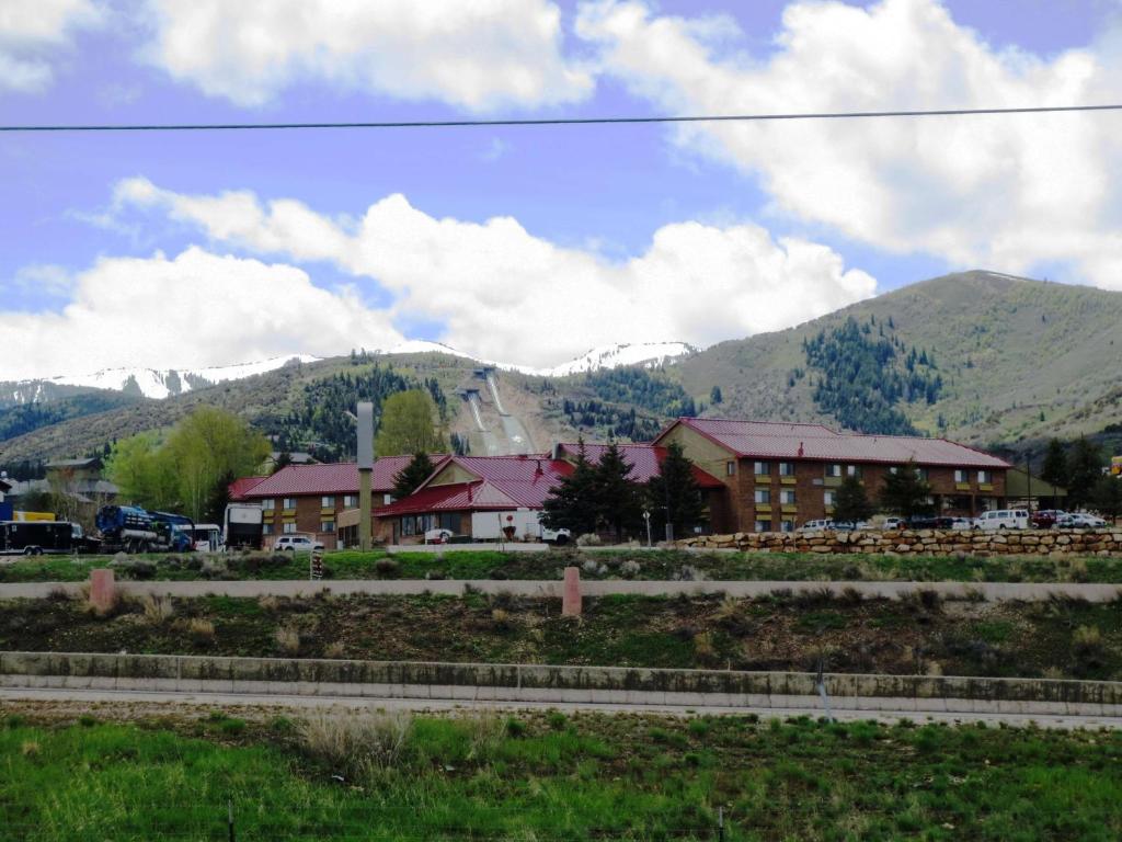 a building with mountains in the background at Best Western Plus Landmark Inn in Park City