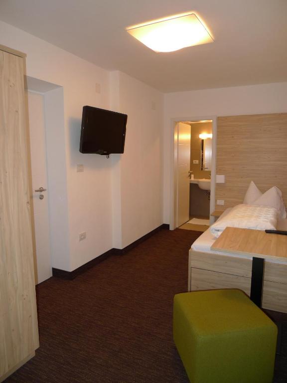 Postel nebo postele na pokoji v ubytování Hotel Stifter