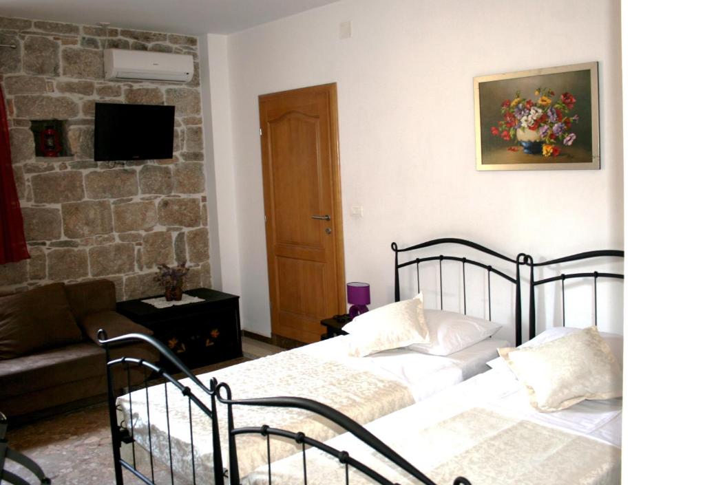 Postel nebo postele na pokoji v ubytování Rooms and Apartments Emily