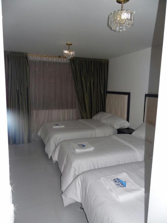 Postel nebo postele na pokoji v ubytování Hotel Mont Bleu