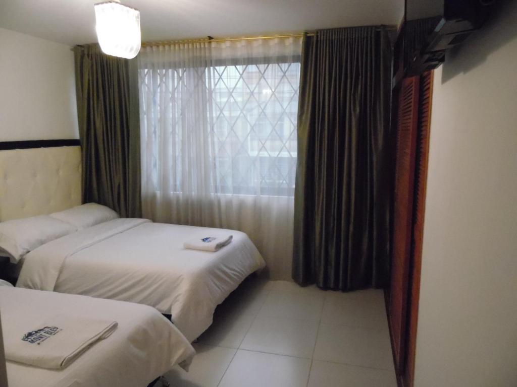 Postel nebo postele na pokoji v ubytování Hotel Mont Bleu