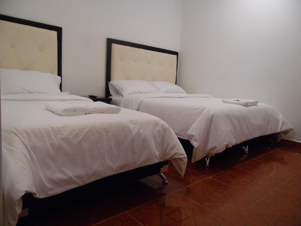 Postel nebo postele na pokoji v ubytování Hotel Mont Bleu