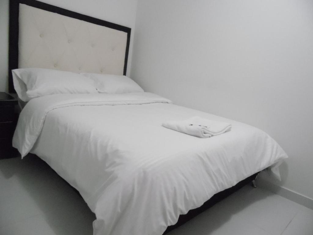Postel nebo postele na pokoji v ubytování Hotel Mont Bleu