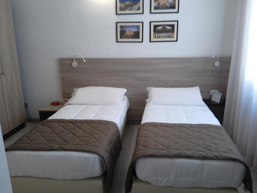 Postel nebo postele na pokoji v ubytování Hotel Citta'