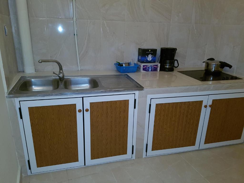 Kuchyň nebo kuchyňský kout v ubytování Appartement alhoceima