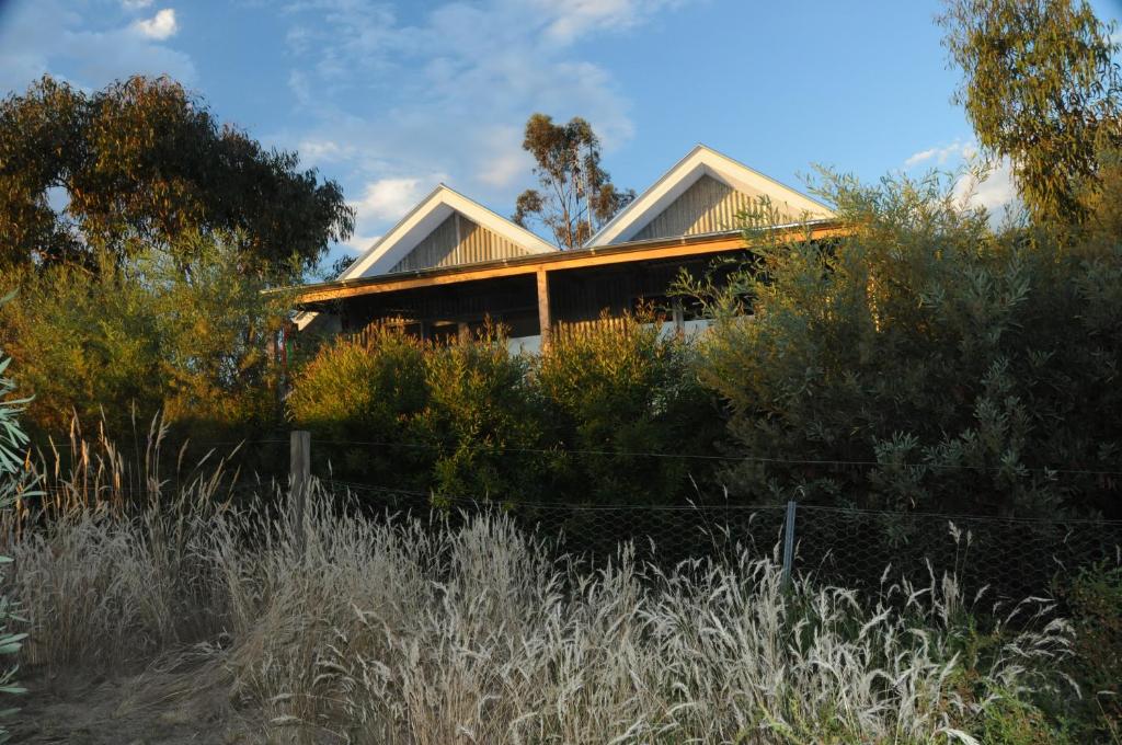 a house sitting on top of a hill at Butterworth Accommodation in Castlemaine
