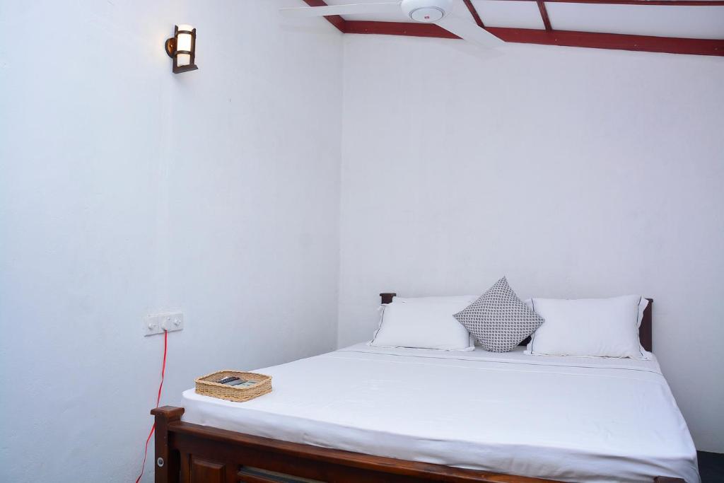 Postel nebo postele na pokoji v ubytování Livinginn Polonnaruwa