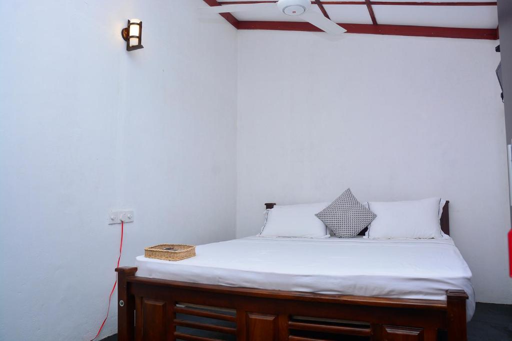 Postel nebo postele na pokoji v ubytování Livinginn Polonnaruwa