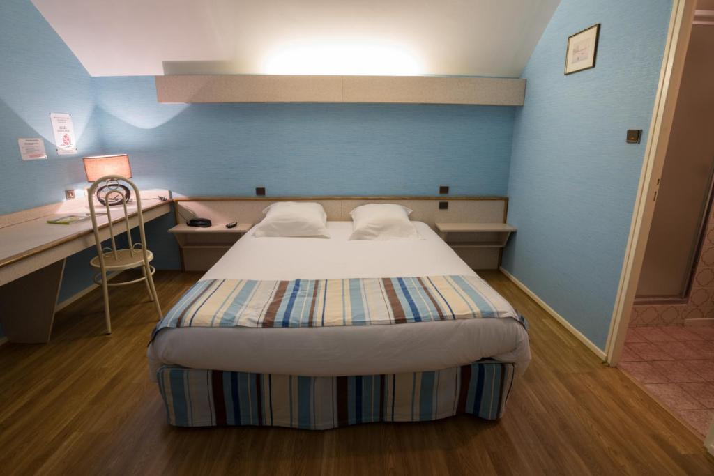 Postel nebo postele na pokoji v ubytování Hotel Spa Le Relais Des Moines