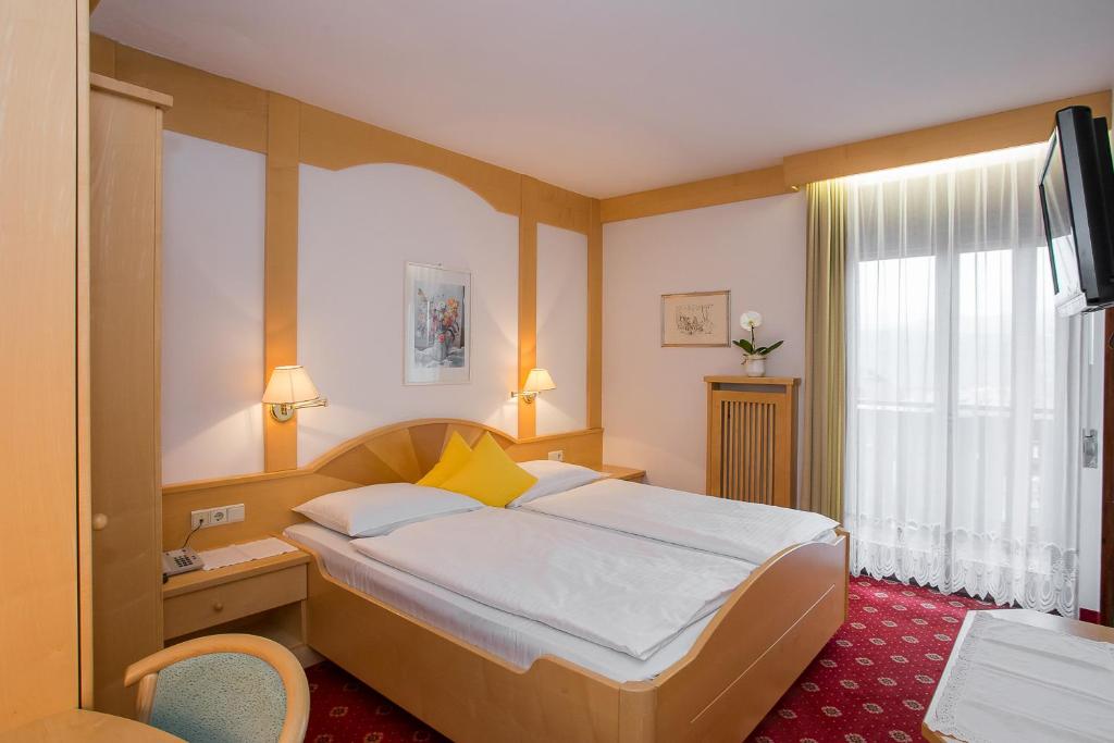 Postel nebo postele na pokoji v ubytování Hotel Alexandres