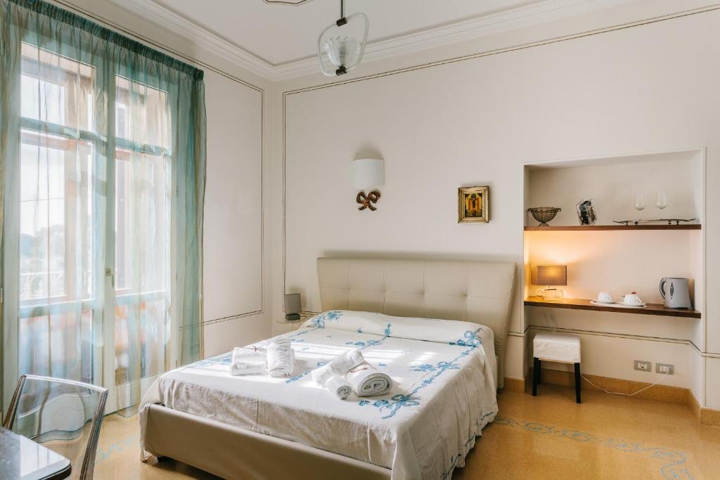Postel nebo postele na pokoji v ubytování Dimora Archimedea