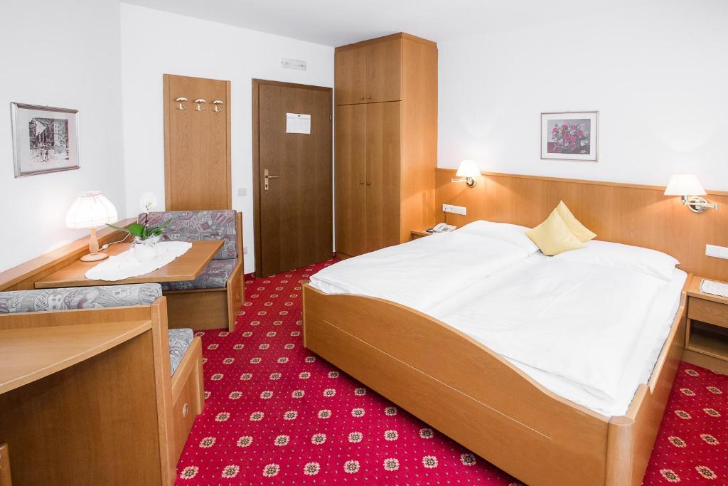 Postel nebo postele na pokoji v ubytování Hotel Alexandres