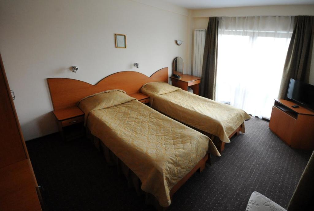Postel nebo postele na pokoji v ubytování Hotel Everest