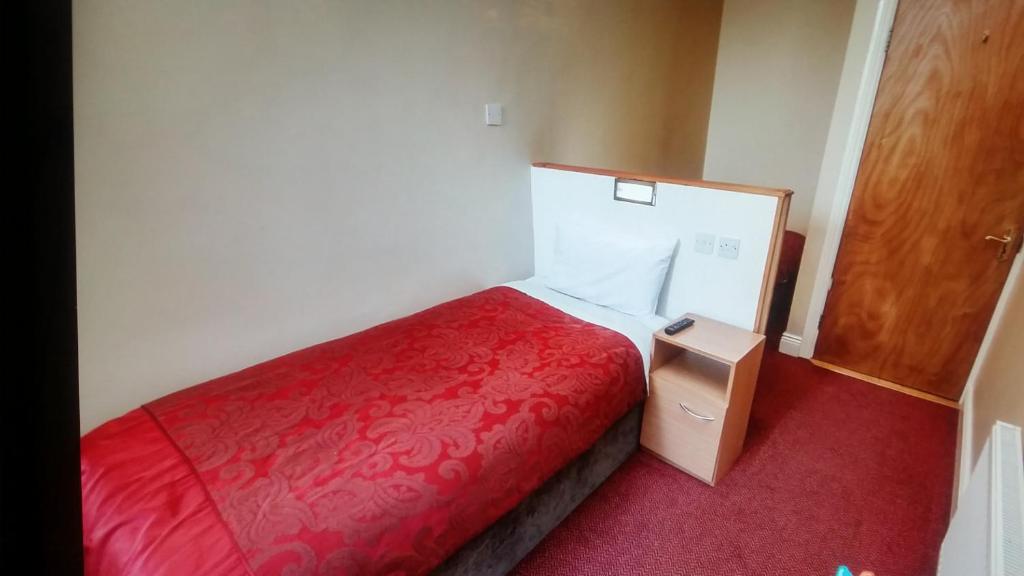 Postel nebo postele na pokoji v ubytování Parkway Guesthouse