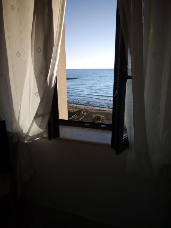 a window view of the ocean from a hotel room at Apartment Nonna Maria in Umag