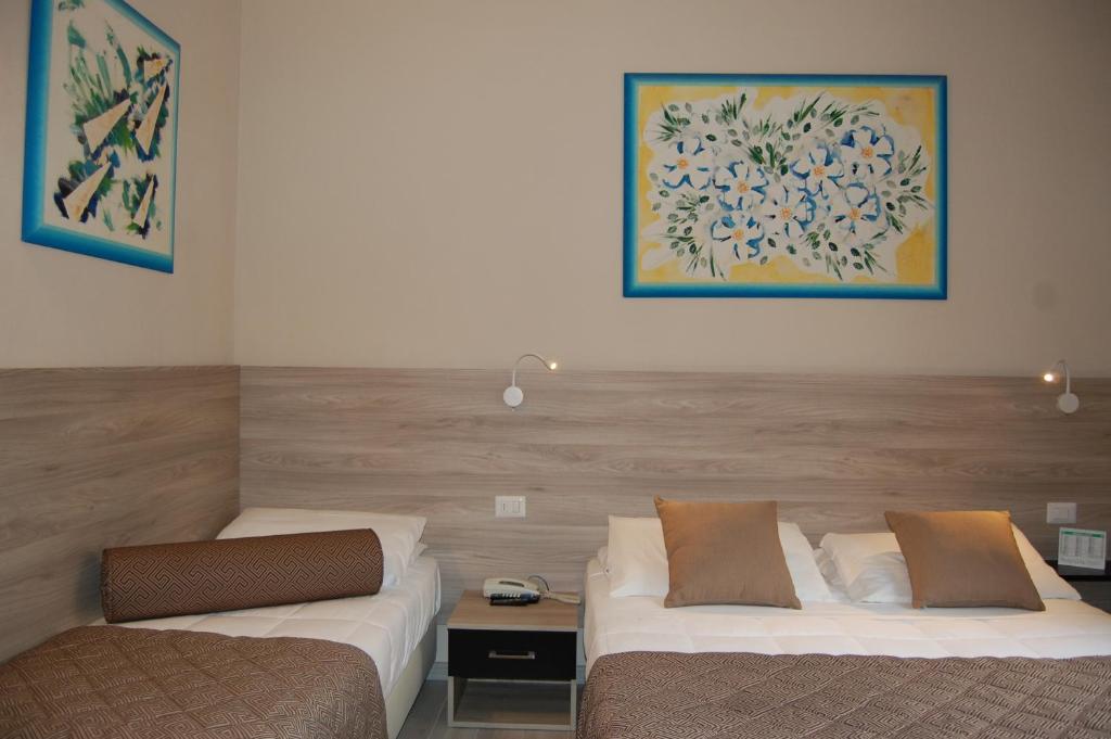 Postel nebo postele na pokoji v ubytování Hotel Citta'