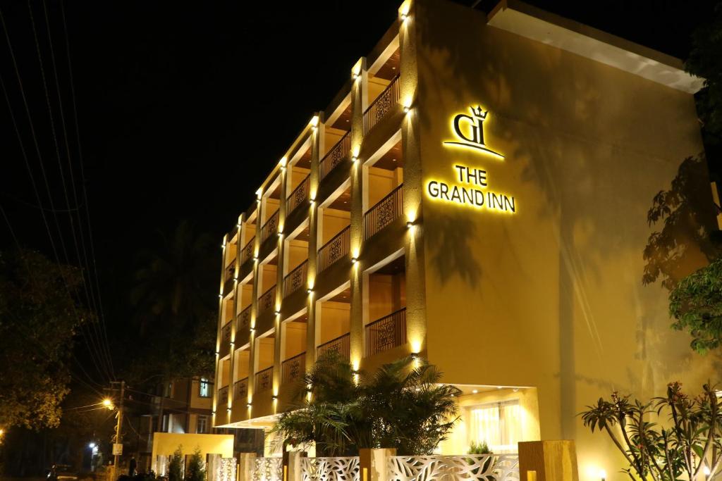 a building with a sign that reads the grand inn at Amara Grand Inn Calangute in Calangute