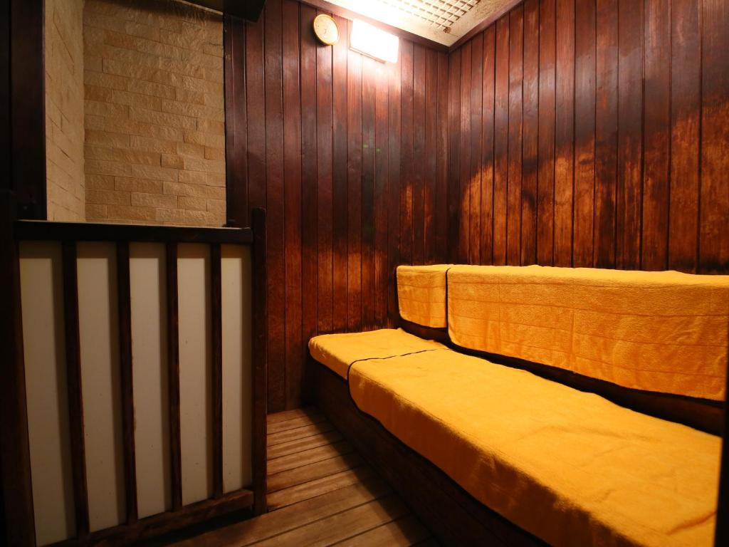 Postel nebo postele na pokoji v ubytování Kasuitei Ooya