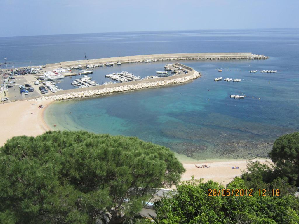 an aerial view of a marina with boats in the water at Albergo Miramare in Cala Gonone