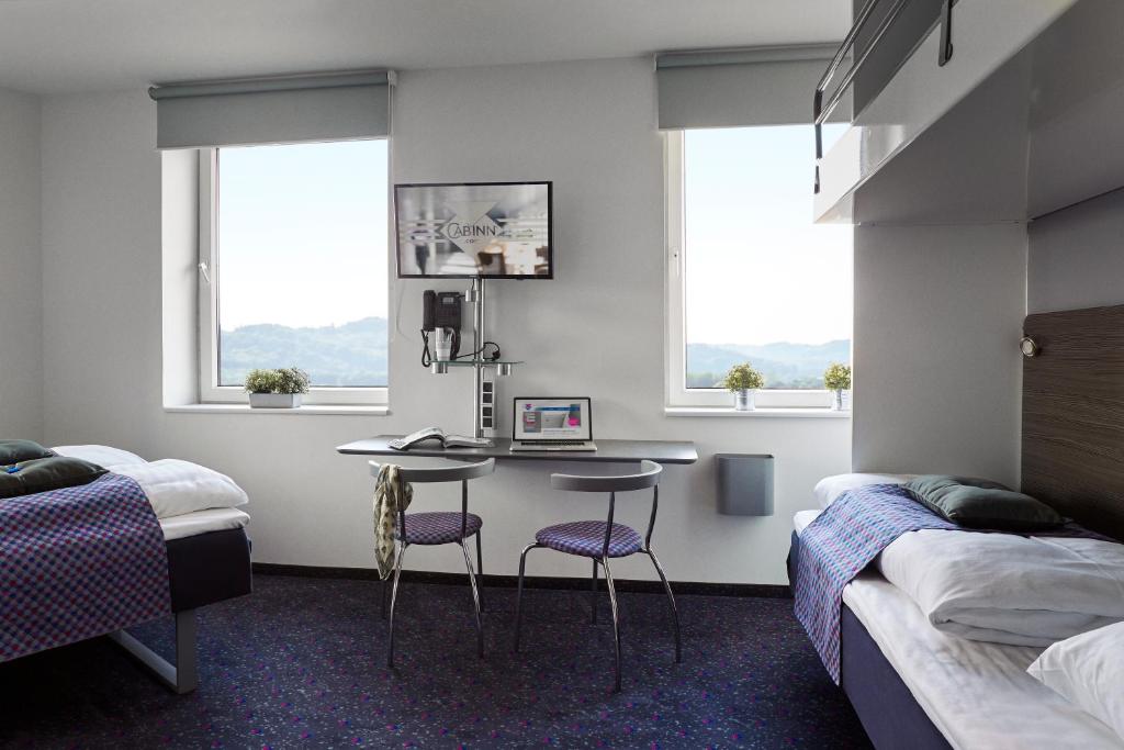 Postel nebo postele na pokoji v ubytování Hotel Cabinn Vejle