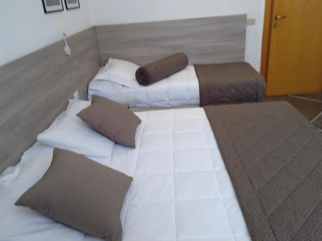 Postel nebo postele na pokoji v ubytování Hotel Citta'