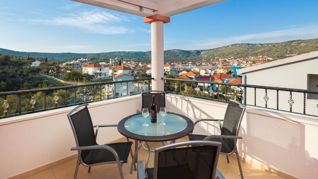 a balcony with a table and chairs and a view at Villa Nada in Vinišće