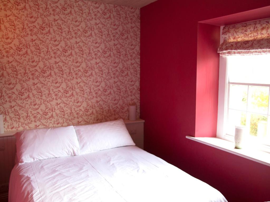 Postel nebo postele na pokoji v ubytování Kilgraney House