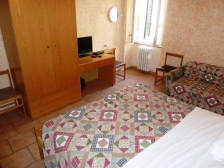 Postel nebo postele na pokoji v ubytování Hotel Bolognese