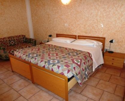 Postel nebo postele na pokoji v ubytování Hotel Bolognese