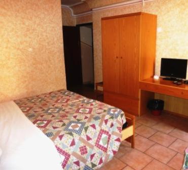 Postel nebo postele na pokoji v ubytování Hotel Bolognese